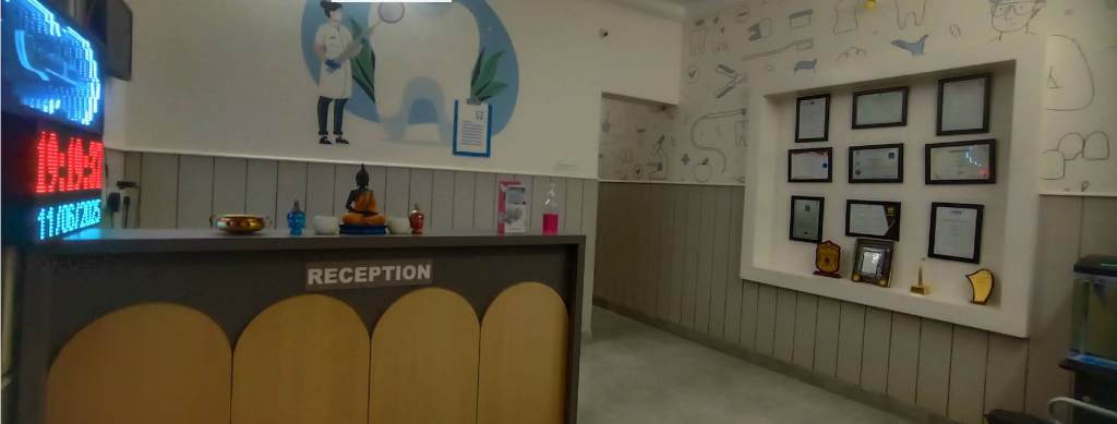 Reception desk with fluted architectural wood arches, framed certificates niche and calming waiting area